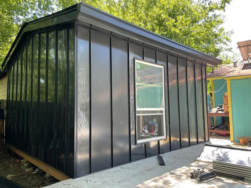 Black standing seam metal wall panels for Metal Roof Installation in Tice